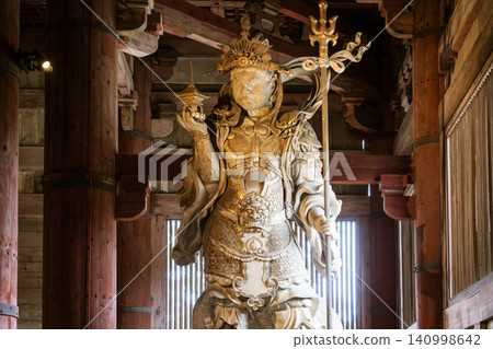 Buddhist statues with carvings Buddhist statues with carvings 140998642