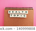 Health topic concept on notebook with pink background 140999808