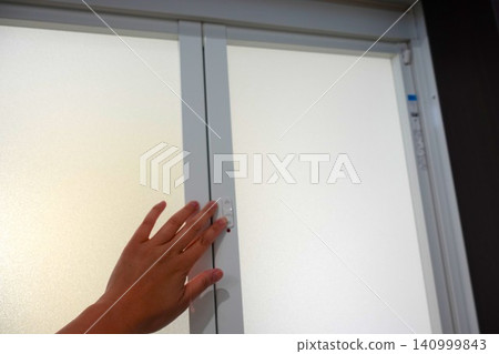 Lock the bathroom door. Lock the bathroom door. 140999843