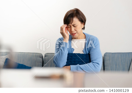 Worried senior woman Worried senior woman 141000129