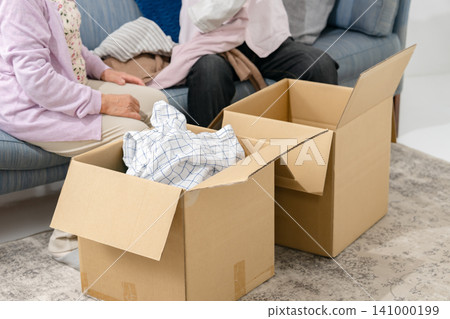 Senior couple, end-of-life planning, decluttering, personal belongings Senior couple, end-of-life planning, decluttering, personal belongings 141000199