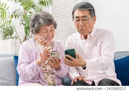 Senior couple with smartphone Senior couple with smartphone 141000217