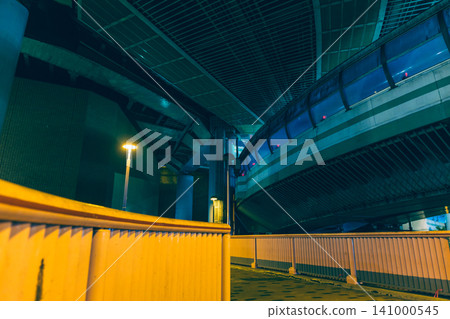 A futuristic, cyberpunk-looking night view of an urban highway junction. A futuristic, cyberpunk-looking night view of an urban highway junction. 141000545