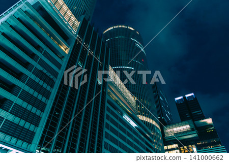 A night view of a cluster of skyscrapers in a major city, exuding a cyberpunk atmosphere. A night view of a cluster of skyscrapers in a major city, exuding a cyberpunk atmosphere. 141000662