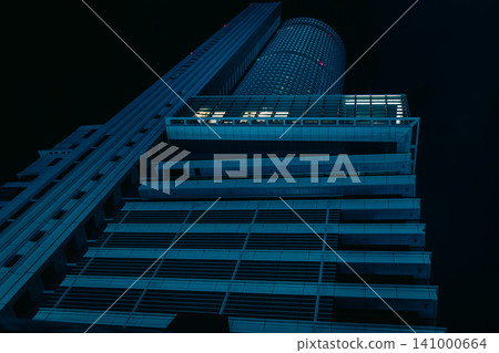 A night view of a cluster of skyscrapers in a major city, exuding a cyberpunk atmosphere. A night view of a cluster of skyscrapers in a major city, exuding a cyberpunk atmosphere. 141000664
