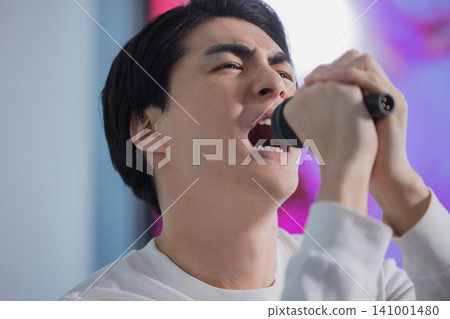 A man sang at a karaoke A man sang at a karaoke 141001480