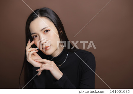 Woman in a black turtleneck Woman in a black turtleneck 141001685