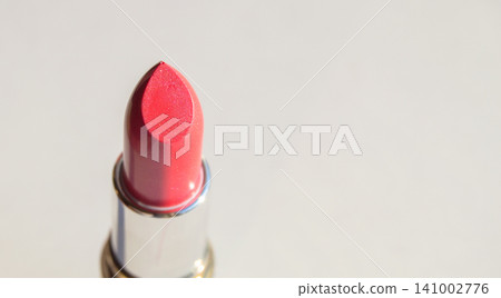 Close-up of pink lipstick on a white background, top view Close-up of pink lipstick on a white background, top view 141002776