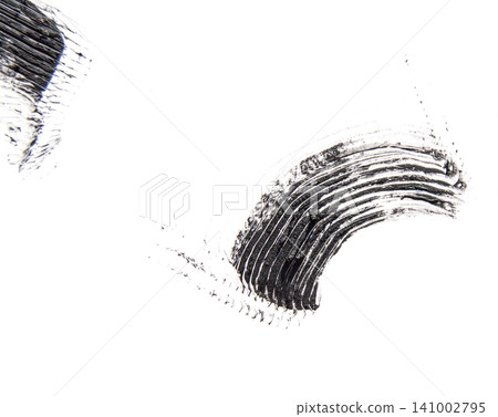 A smear or sample of black mascara isolated on a white background A smear or sample of black mascara isolated on a white background 141002795
