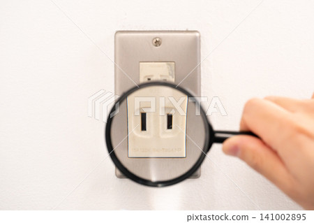 Electrical outlet, magnifying glass 141002895