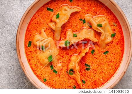 Coconut creamy dumpling soup or curry dumpling soup. Coconut creamy dumpling soup or curry dumpling soup. 141003630