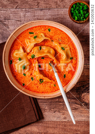 Coconut creamy dumpling soup or curry dumpling soup. Coconut creamy dumpling soup or curry dumpling soup. 141003632