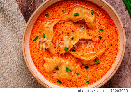 Coconut creamy dumpling soup or curry dumpling soup. Coconut creamy dumpling soup or curry dumpling soup. 141003633