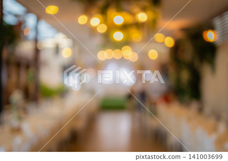 Vintage tone blur image of food stall at night festival with bokeh for background usage. Vintage tone blur image of food stall at night festival with bokeh for background usage. 141003699