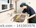 A house cleaning woman cleaning the sink 141003976