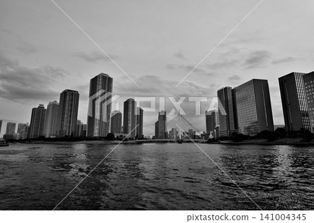 Eitai Bridge, Sumida River Terrace: A cloudy evening view of the cluster of high-rise apartment buildings in Tsukuda, Chuo Ward. (Monochrome) Eitai Bridge, Sumida River Terrace: A cloudy evening view of the cluster of high-rise apartment buildings in Tsukuda, Chuo Ward. (Monochrome) 141004345