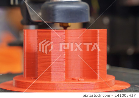 Macro photograph of the layered texture and detail on a 3D model created by a 3D printing machine. 141005437