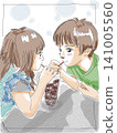 A brother and sister drink juice together. 141005560