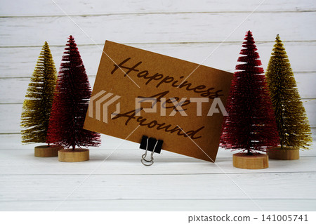 Happiness All Around text written on paper card for Christmas holidays celebration Happiness All Around text written on paper card for Christmas holidays celebration 141005741