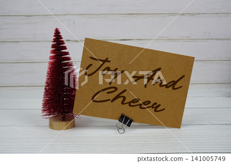Joy and Cheer  text written on paper card for Christmas holidays celebration 141005749