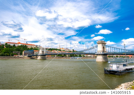 Budapest, Hungary: The Széchenyi Chain Bridge, a UNESCO World Heritage Site spanning the Danube River, and the cityscape of the Royal Palace Hill. 141005915