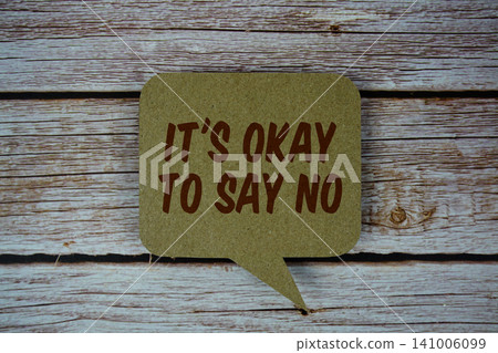 It's Okay To Say No text with speech bubble on wooden background It's Okay To Say No text with speech bubble on wooden background 141006099