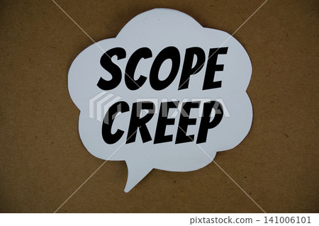 Scope Creep  text with speech bubble top view on paper craft background 141006101