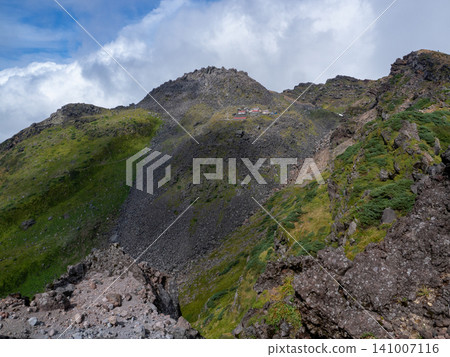 A magnificent panoramic view of Mount Chokai, with its towering peaks stretching as far as the eye can see. A magnificent panoramic view of Mount Chokai, with its towering peaks stretching as far as the eye can see. 141007116