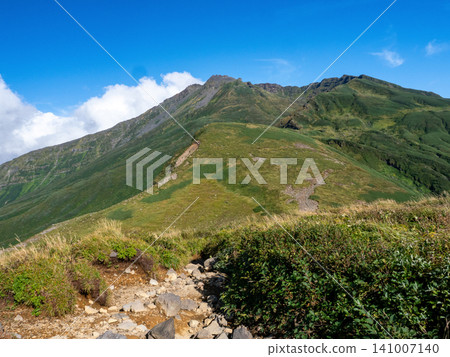 Green ridgeline stretching towards the morning blue sky Green ridgeline stretching towards the morning blue sky 141007140