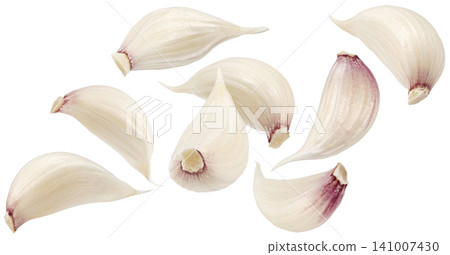 Falling garlic cloves isolated on white background with clipping path 141007430