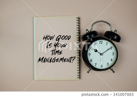 How Good Is Your Time Management? text with alarm clock on pink background How Good Is Your Time Management? text with alarm clock on pink background 141007883