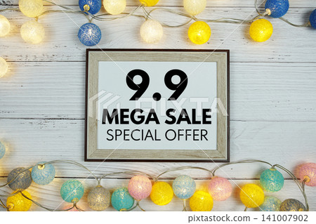 9.9 Mega Sale text with LED cotton balls decoration on wooden background 9.9 Mega Sale text with LED cotton balls decoration on wooden background 141007902