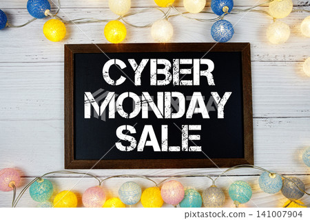 Cyber Monday Sale text with LED cotton balls decoration on wooden background Cyber Monday Sale text with LED cotton balls decoration on wooden background 141007904