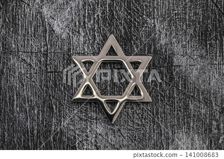 Jewish star of david on old wooden wall 141008683
