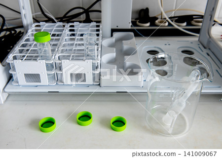 Laboratory sample preparation with test tubes, beaker in analytical laboratory Laboratory sample preparation with test tubes, beaker in analytical laboratory 141009067