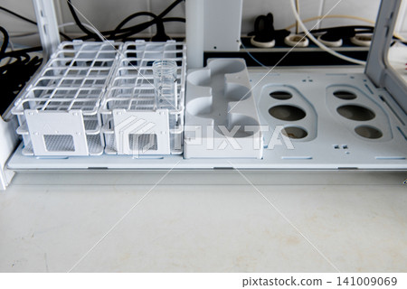 Laboratory sample preparation with test tubes, beaker in analytical laboratory Laboratory sample preparation with test tubes, beaker in analytical laboratory 141009069