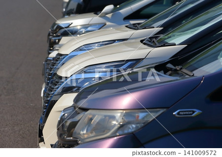 Image of cars lined up in a parking lot Image of cars lined up in a parking lot 141009572