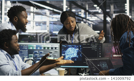 Data center engineering team react to a cyberattack on a computer, securing server equipment and protecting confidential data. Data center engineering team react to a cyberattack on a computer, securing server equipment and protecting confidential data. 141009792