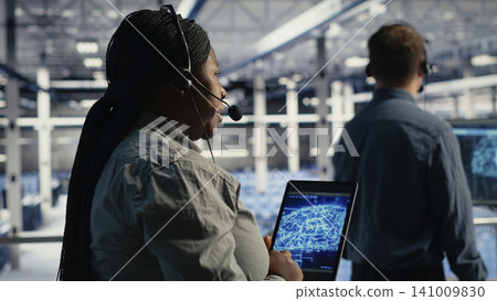 Data center colleagues use AI tools to help customers resolve website hosting problems and service interruptions. Data center colleagues use AI tools to help customers resolve website hosting problems and service interruptions. 141009830