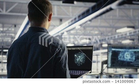 Engineer tunes AI model settings on a computer workstation in a server hub to improve processing speed. Engineer tunes AI model settings on a computer workstation in a server hub to improve processing speed. 141009867