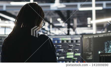 System administrator reviews node tree software to analyze datasets and improve server infrastructure performance. System administrator reviews node tree software to analyze datasets and improve server infrastructure performance. 141009890