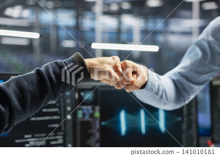 Administrator celebrates in a data center after successfully programming with generative AI assistance. Administrator celebrates in a data center after successfully programming with generative AI assistance. 141010181