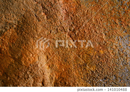 Brown corrosion marks spreading on the concrete surface material 141010488