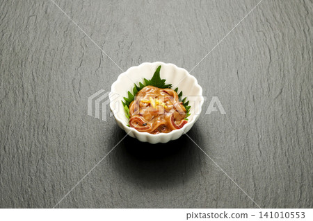 Salted squid in a small dish 141010553