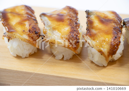 Eel grasping sushi Eel grasping sushi 141010669