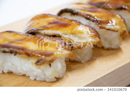 Eel grasping sushi Eel grasping sushi 141010670