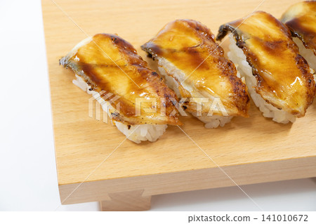 Eel grasping sushi Eel grasping sushi 141010672