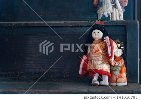 Japanese dolls placed on a shelf Japanese dolls placed on a shelf 141010793