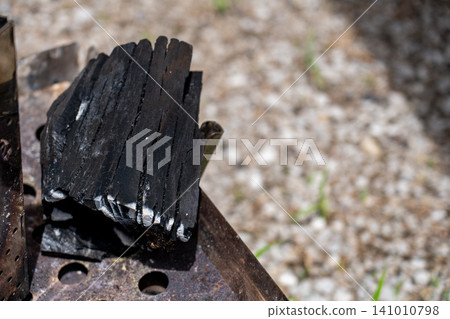 Charcoal for a campfire Charcoal for a campfire 141010798