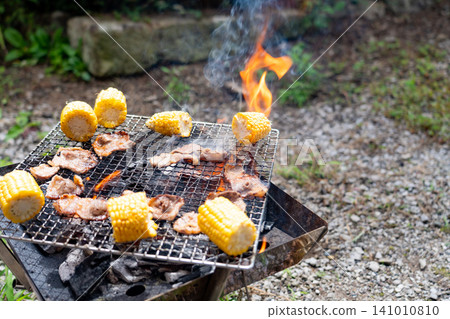 Flaming charcoal barbecue Flaming charcoal barbecue 141010810